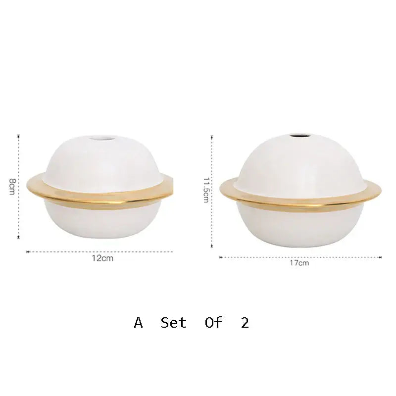 White ceramic diffuser with gold metallic ring base shown alongside abstract gold resin statue for living room decor