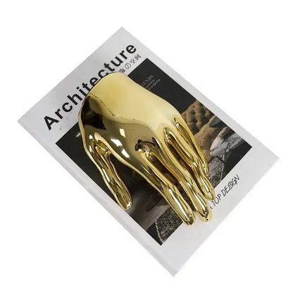 Shiny golden hands resin sculpture with smooth reflective surface and stylized fingers for decorbites abstract golden decor