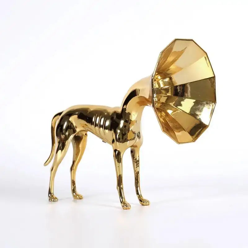 Abstract golden trumpet dog sculpture featuring a slender metallic design with a faceted gramophone horn head for living room decor