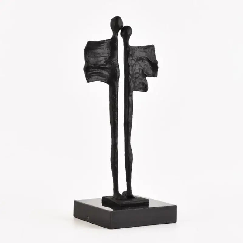Black abstract iron cast couple sculpture with stylized figures on matching base for decorbites abstract iron decor