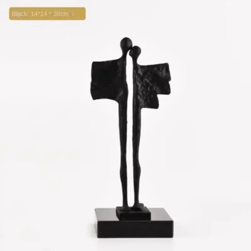 Black abstract iron cast couple statue with stylized figures on matching base for decorbites abstract iron living room decor