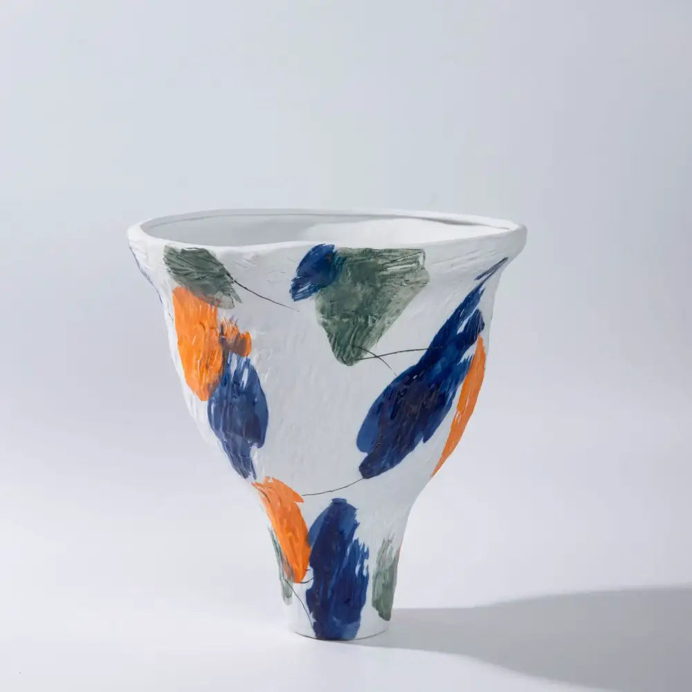 A white ceramic abstract irregular vase set with bold navy blue and orange brushstrokes for living room decorbites decor