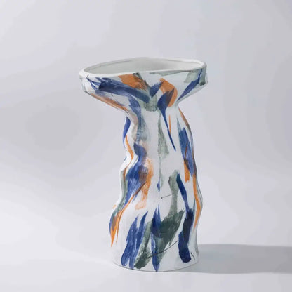 A white ceramic abstract irregular vase with flared top and bold blue orange green brushstrokes for decorbites vase set