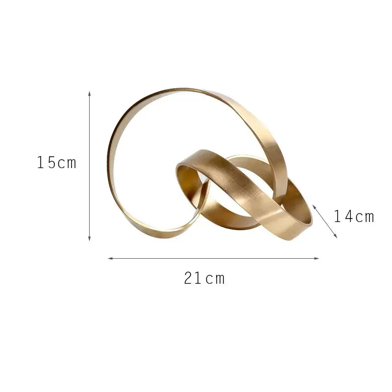 A sleek abstract knot golden metal sculpture with three interlocking brass rings for living room decor by decorbites