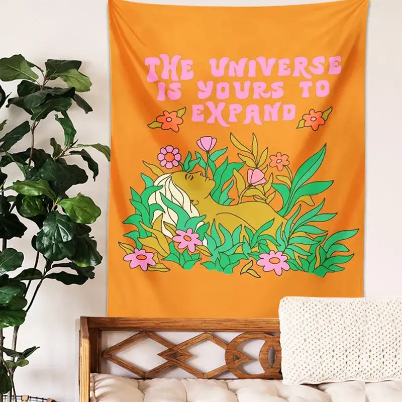Vibrant orange abstract landscape flower tapestry featuring stylized person and foliage with bold pink text decorbites abstract landscape