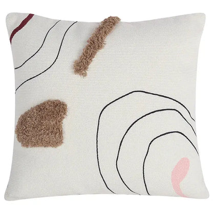 Cream cushion cover with abstract line colors design featuring black stitched lines brown tufts and pink accent for decorbites decor