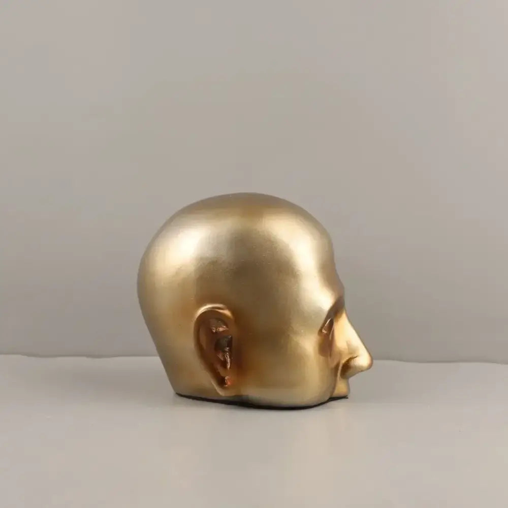 Golden metallic abstract minimalist golden head half sculpture in profile for home decor by decorbites golden head