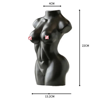 Black glossy resin abstract nude female torso sculpture with defined abs and smooth contours for living room decor