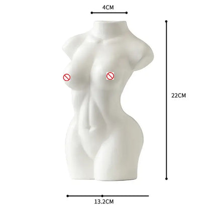 White ceramic vase shaped like an abstract nude female torso for living room decor