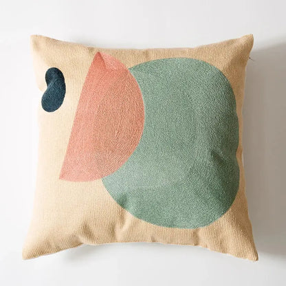 Beige cushion cover with embroidered abstract teal circle peach semicircle and dark blue teardrop decorbites geometric cushion