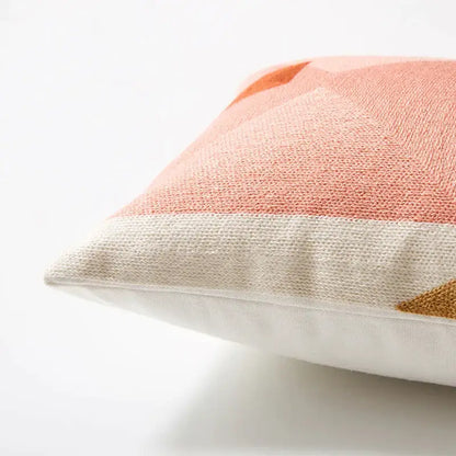 A soft peach and cream pastel geometric cushion cover with textured woven fabric for living room decorbites geometric cushion