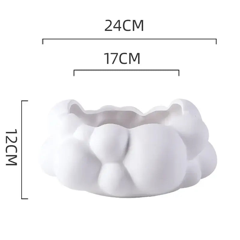 A white abstract patchwork ceramic cloud planter with textured surface and rounded contours for living room decor