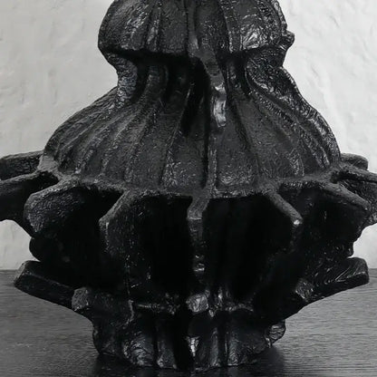 Black textured abstract pleated gear resin vase with intricate ridges for living room decor and flower holding