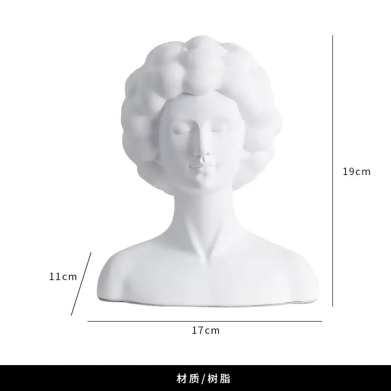 White resin abstract portrait bust sculpture with curly hair and serene expression for black and white living room decorbites abstract portrait