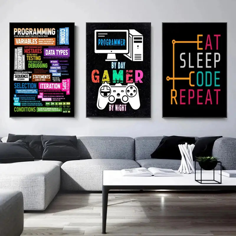 Three framed vibrant abstract programmer gamer posters with colorful text above a gray sectional sofa by decorbites