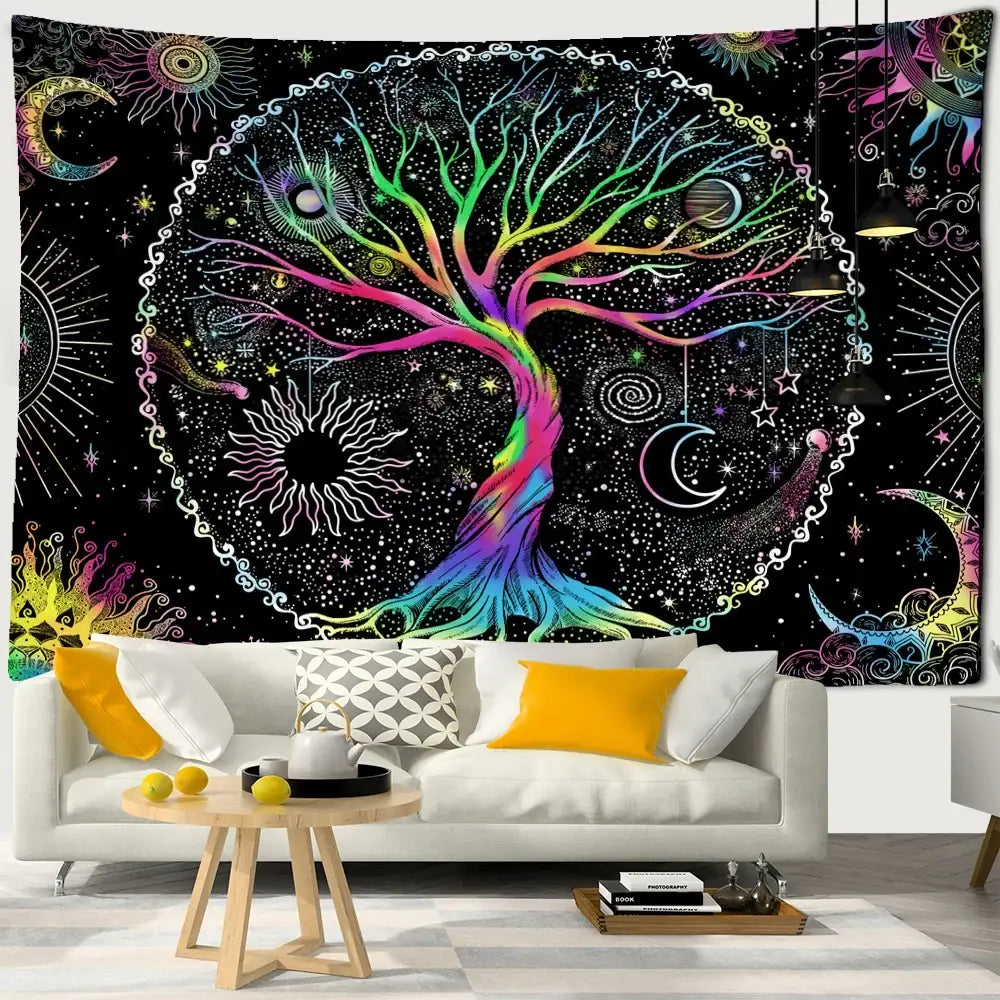 Abstract tree of life tapestry wall hanging with vibrant rainbow colors and celestial motifs above white sofa