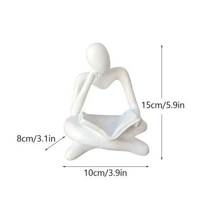 White ceramic abstract resin book figurine of seated thinker holding open book for black and white office decorbites decor