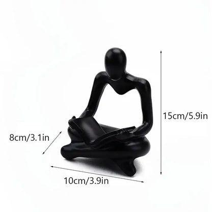 Black glossy resin book figurine of a seated human reading for decorbites abstract resin office decorbites abstract resin decorbites abstract resin office decor