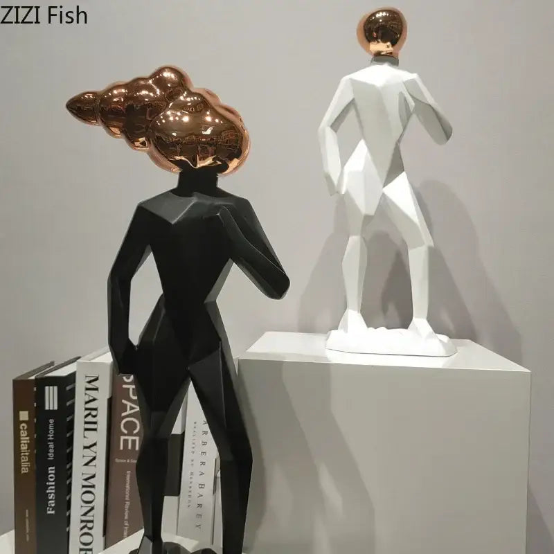 Black and rose gold geometric abstract resin sculpture with shell-like head for resin sculpture room decor by decorbites