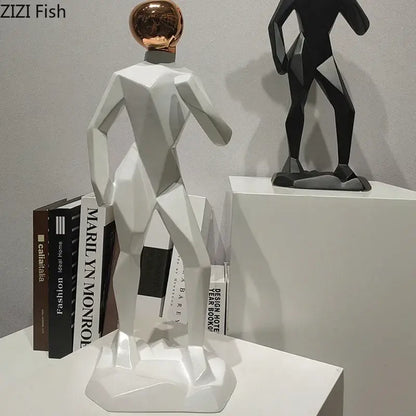 Abstract resin sculpture of a white geometric human figure with a rose gold spherical head for resin sculpture room decorbites