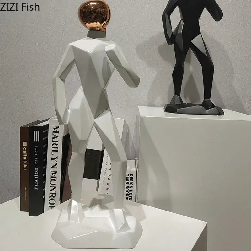 Abstract resin sculpture of a white geometric human figure with a rose gold spherical head for resin sculpture room decorbites