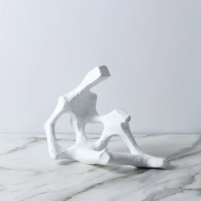 White abstract skeleton decor figure sculpture with angular geometric forms and textured surface for living room bookends