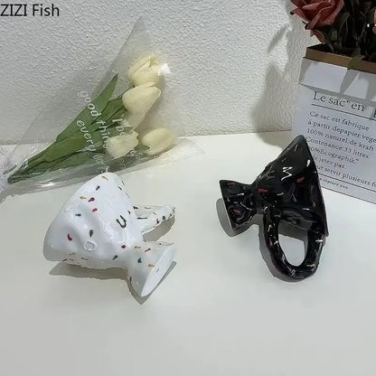 White ceramic mug with colorful speckles and glossy finish paired with black decorative ceramic mug for dining room decorbites colorful icing