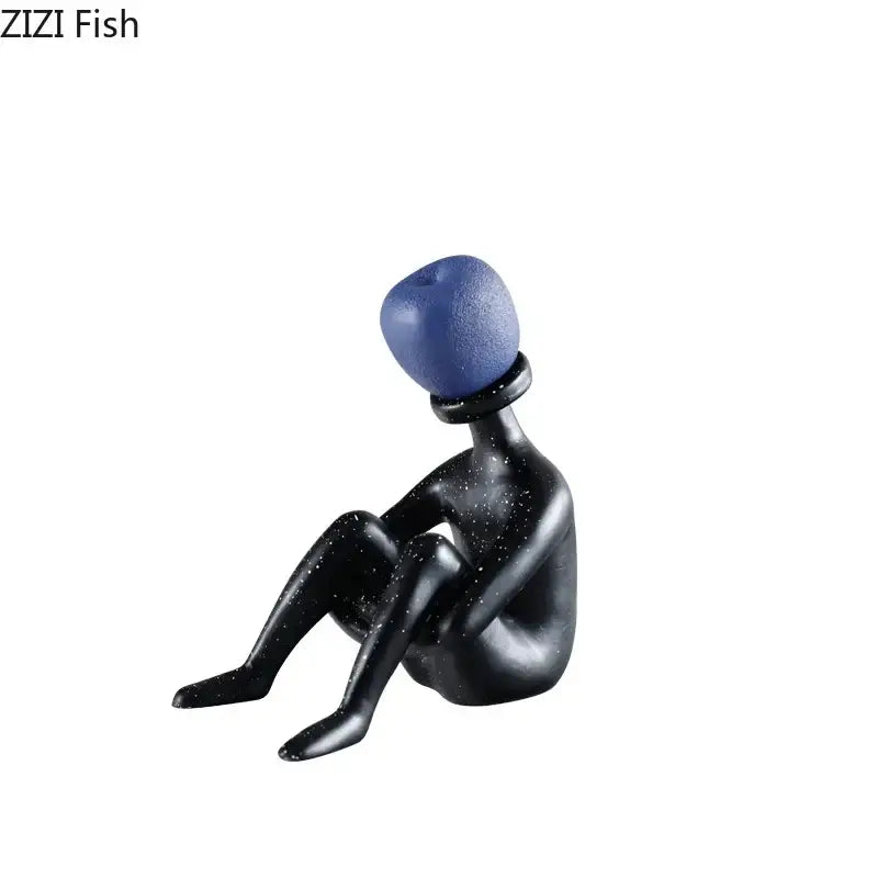 Black resin abstract thinker figurine with blue textured spherical head and speckled surface for living room decor