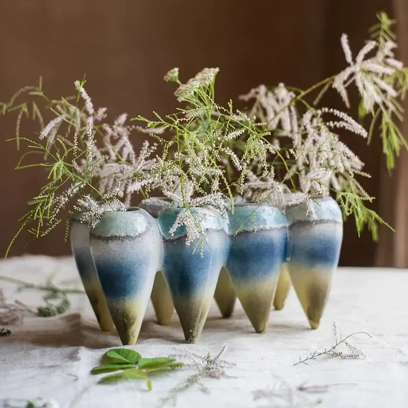 A set of five ceramic abstract tooth hanging vases with blue to green gradient glaze for living room decorbites decor