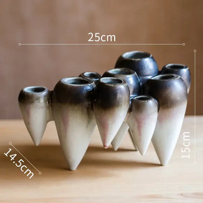 A cluster of ceramic abstract tooth hanging vases with blue and green gradient glaze for decorbites abstract tooth decor