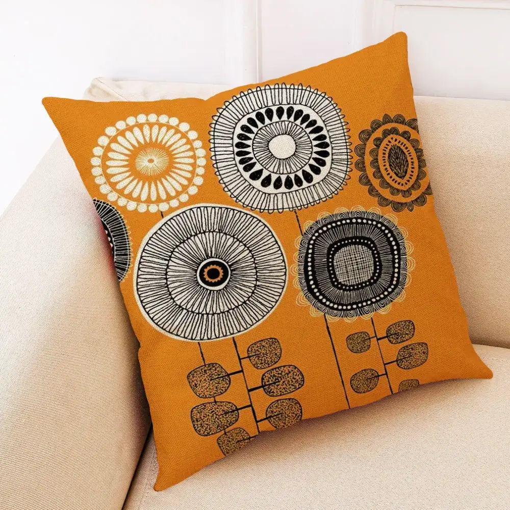 Orange throw pillow cover with abstract tree flower embroidered geometric floral pattern in black white and beige