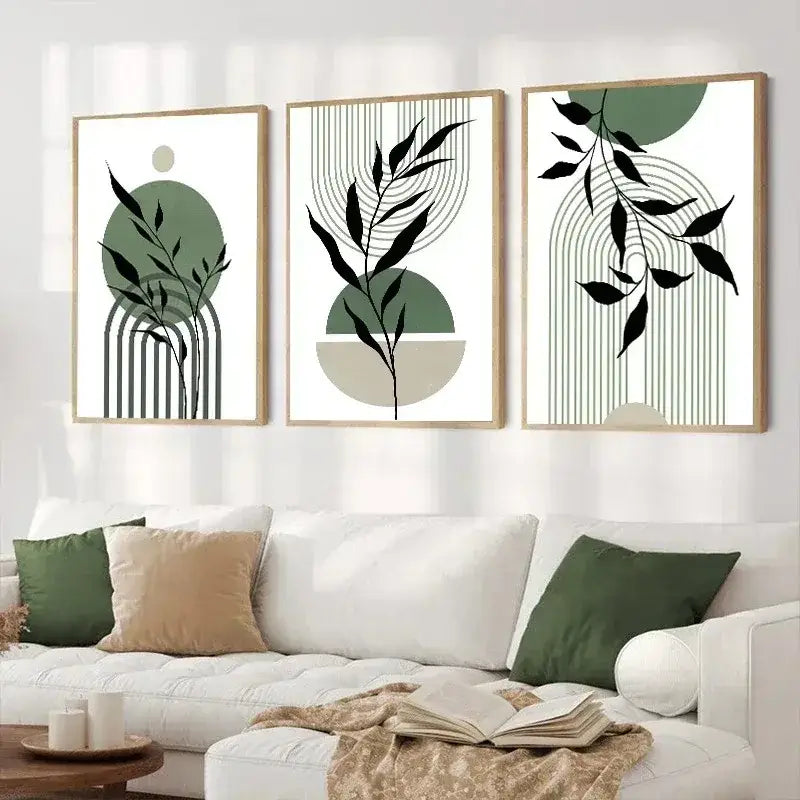 Set of three DecorBites™ abstract green plants wall art pieces with minimalist green and black leaf designs in light wood frames