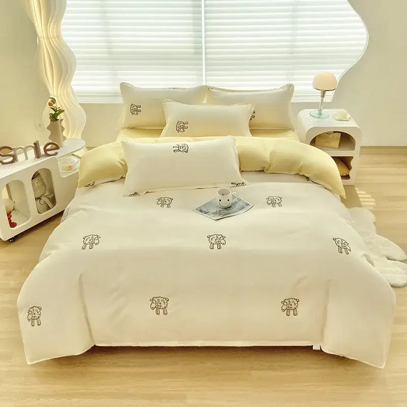 Cream-colored duvet cover set with embroidered sheep motifs featuring decorbites cute pattern for bedroom decor