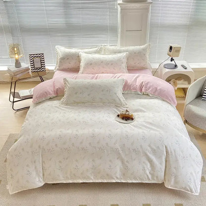 A soft pastel pink and cream floral patterned duvet cover with a decorbites cute pattern for bedroom decor