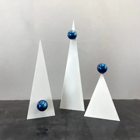 Set of three abstract white geometric triangle decor bites ornaments topped with glossy blue spheres for living room decor