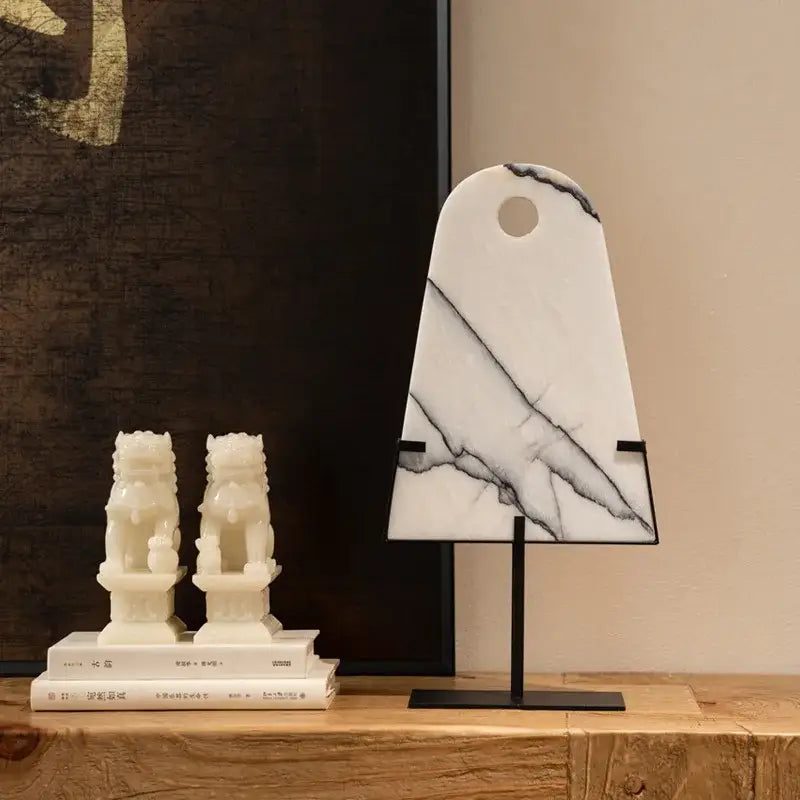 Abstract white and black marble sculpture with circular hole on black metal stand for living room decorbites abstract jade pendant