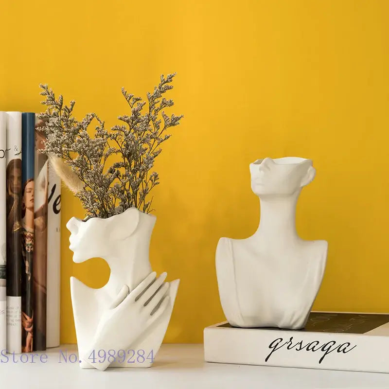 Abstract white ceramic vase portrait ornament featuring a half face and integrated hand holding dried flowers for living room decor