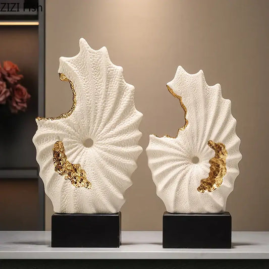 Abstract white and gold gilded ceramic landscape shell sculptures mounted on black bases for living room decor