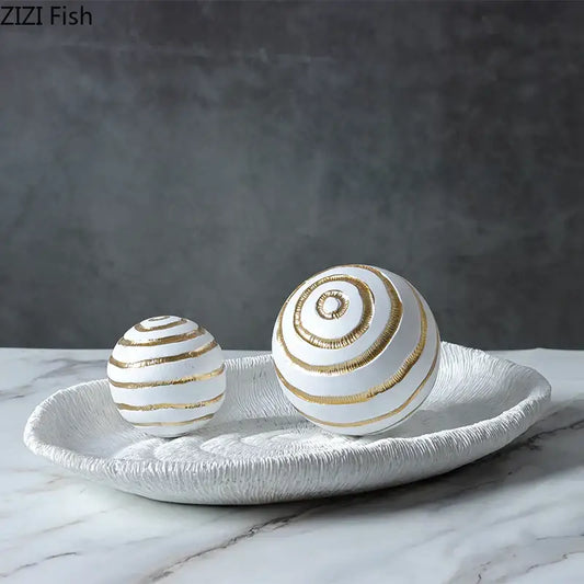 Abstract white and gold ceramic texture ball sculpture featuring golden texture balls on a textured tray for living room decor