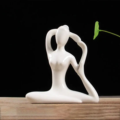 White ceramic abstract yoga figure of a woman in a graceful pose for living room decor by decorbites