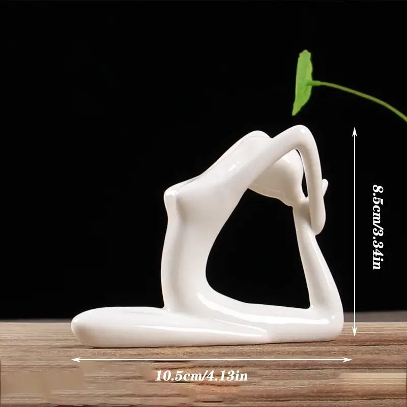 Abstract white porcelain yoga figure in a living room decor with a green leaf sprouting from its head by decorbites abstract yoga