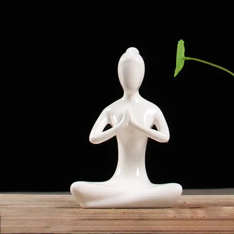 Abstract white porcelain yoga figure in a meditative pose perfect for living room decorbites abstract yoga decor