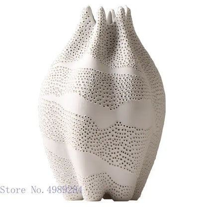 Abstract white textured ceramic vase with wavy bands and dot pattern decorbites dot pattern for living room decor