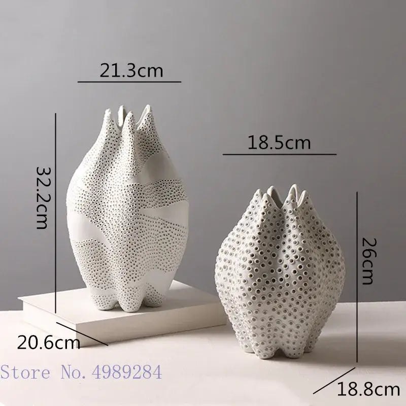 Abstract white textured ceramic vase with perforated petal shapes featuring decorbites dot pattern for living room decor