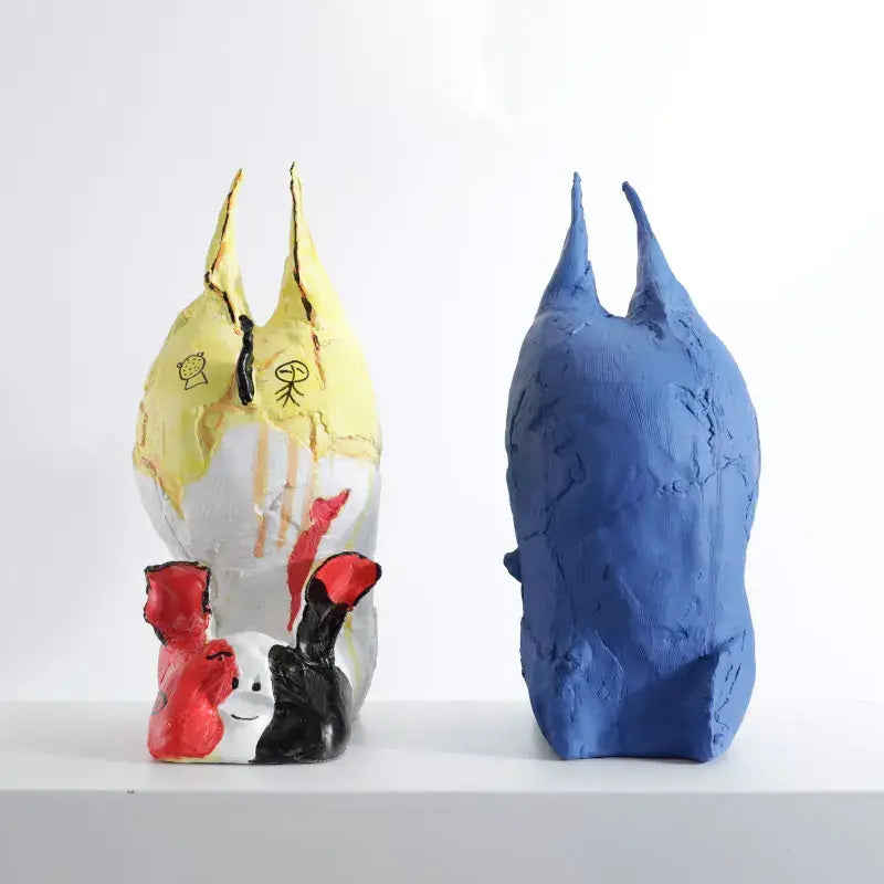 Two abstract cartoon pig handicrafts in vibrant yellow with drawings and solid blue for decorbites bedroom decor