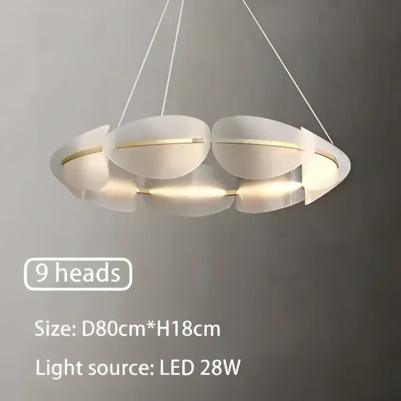 Modern white DecorBites acrylic ring chandelier with nine circular led heads and sleek metallic accents for dining rooms