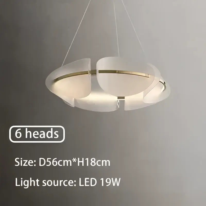 Modern white acrylic ring chandelier with six circular led heads and a sleek dimmable design for dining room use