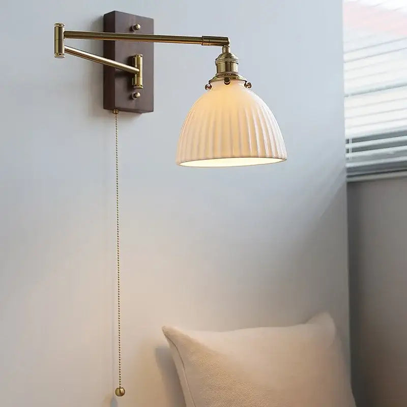 Adjustable brass wall sconce with copper arm ribbed off-white glass shade and wooden backplate for bedroom decorbites copper arm
