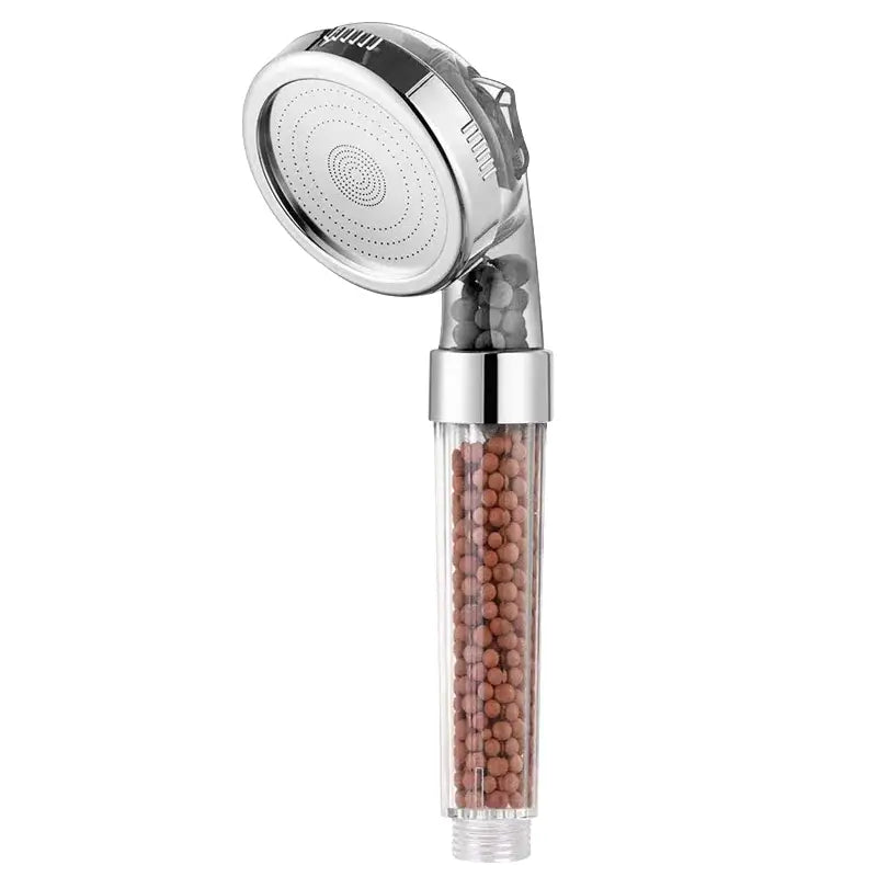 Adjustable high pressure chrome shower head with transparent filter housing containing brown filtration beads for bathroom