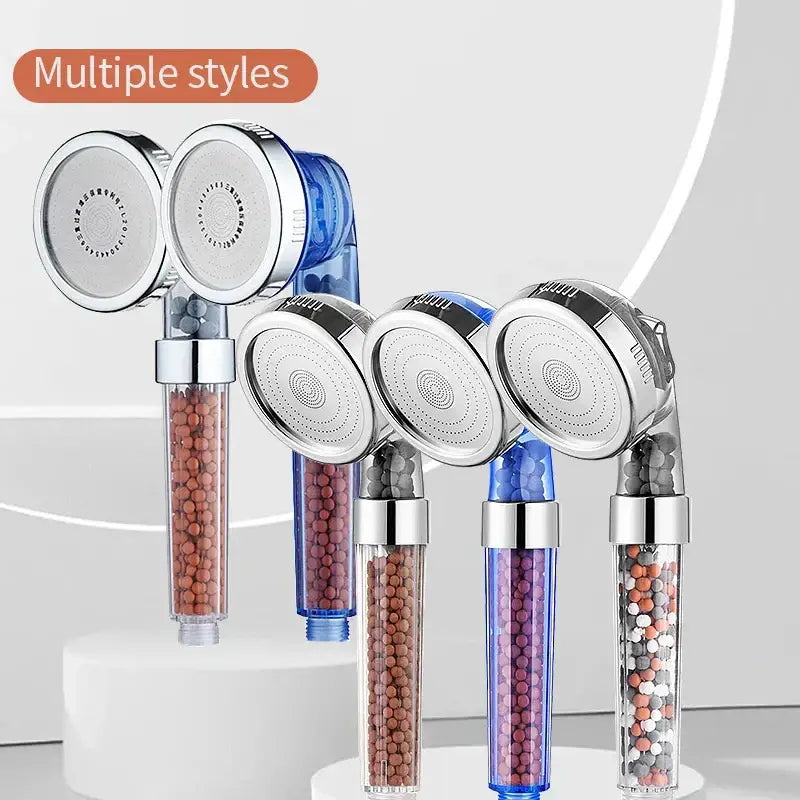 Adjustable high pressure clear cylindrical shower head with silver metal heads and brown, blue, or multicolored filter beads